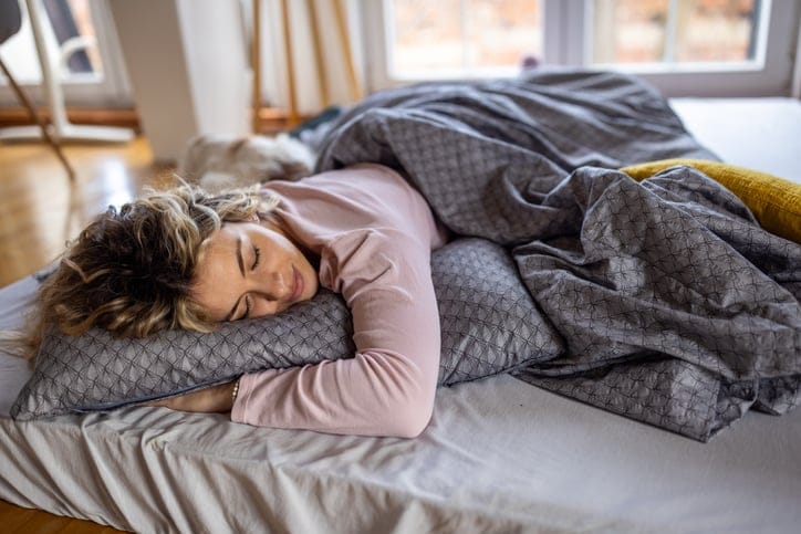 woman sleeping in bed peacefully