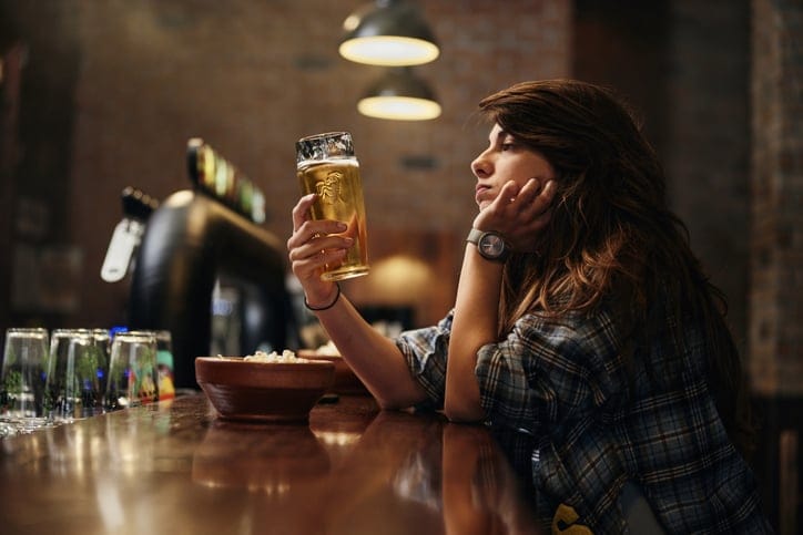 lonely woman at bar