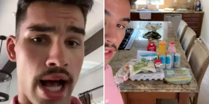 man showing $100 groceries