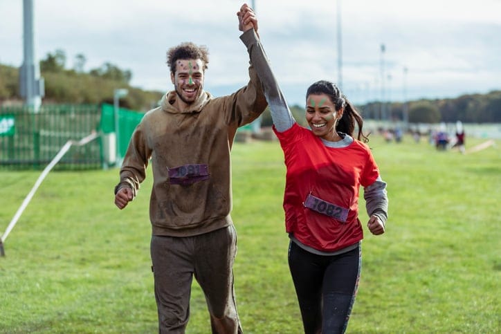 sporty couple celebrating athletic win