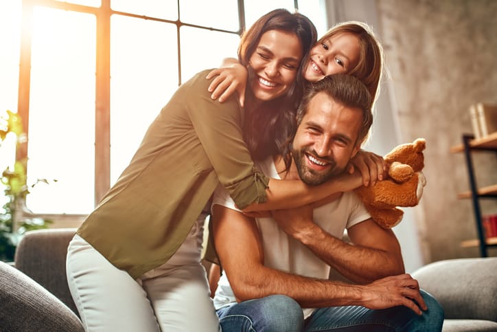 Happy dad and mom with their cute daughter