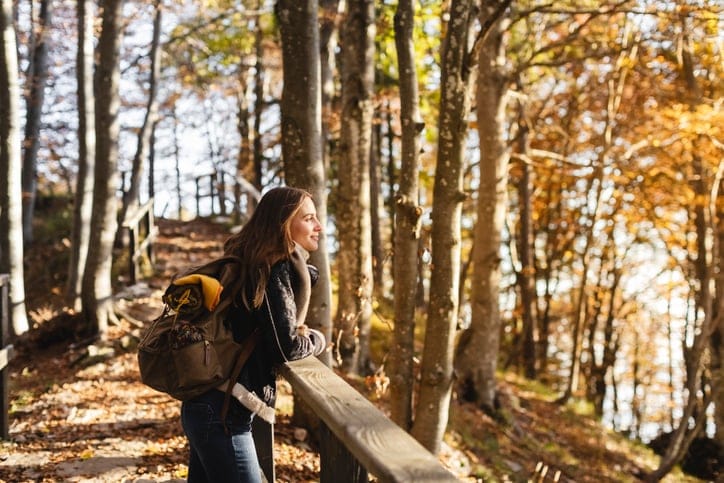 Hiker enjoying the autumn forest.