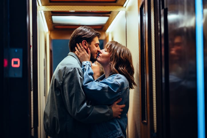 Romantic kiss in the elevator.