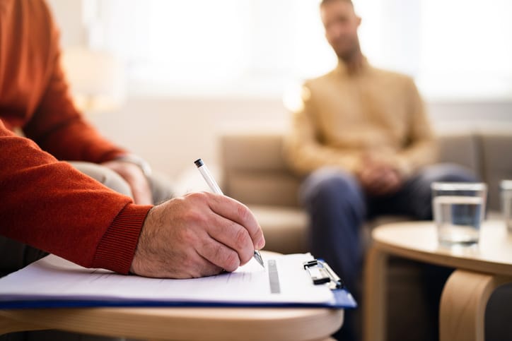 Psychotherapist with male patient.