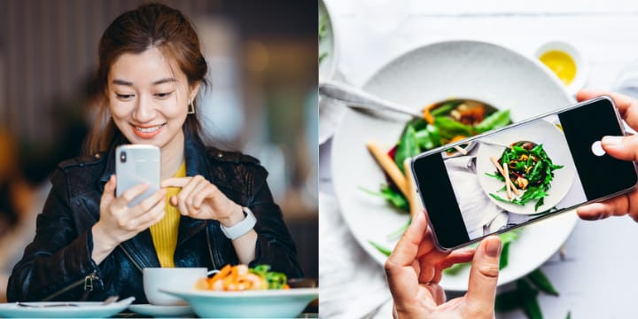 Woman at restaurant taking selfies.