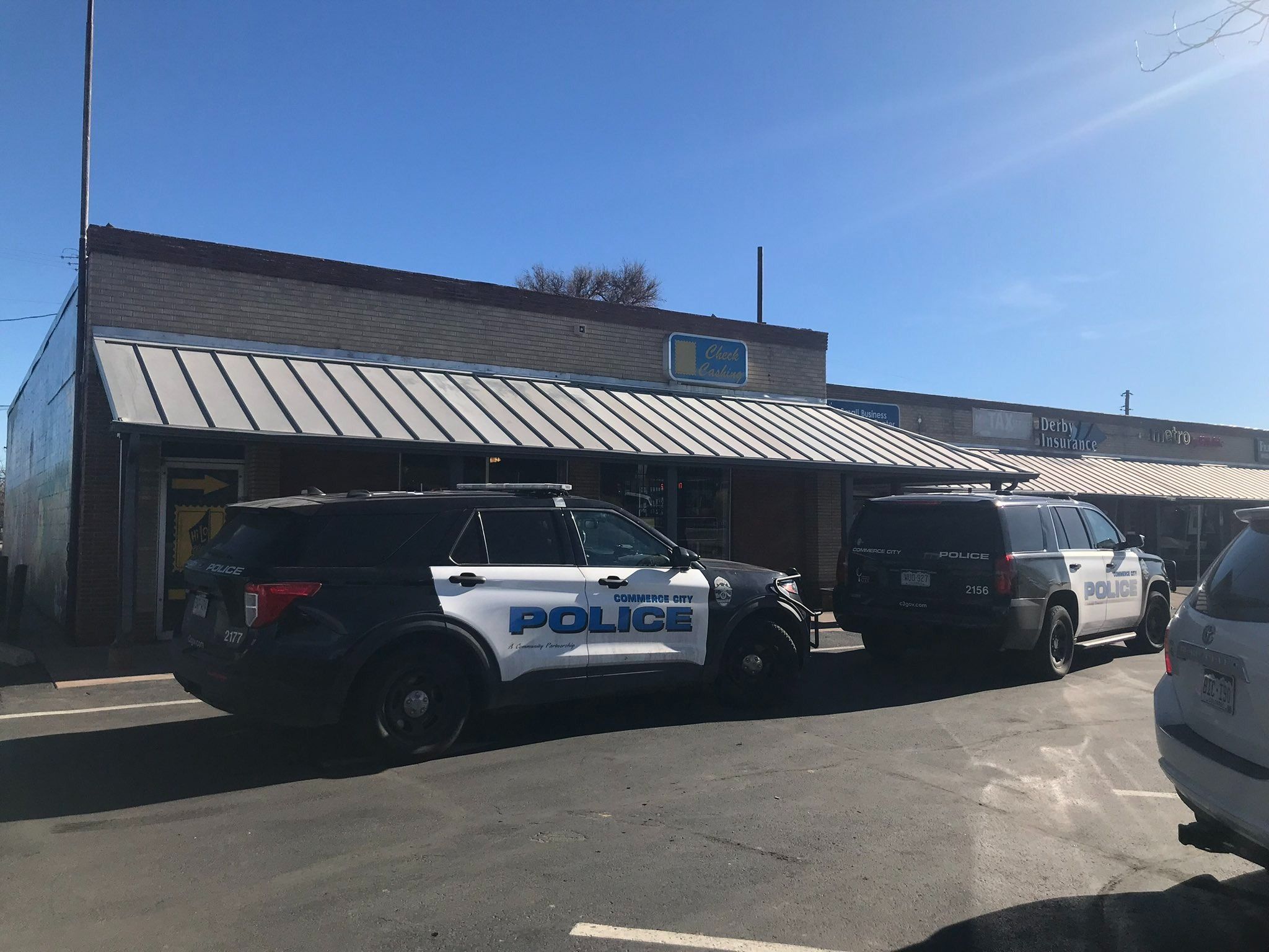 commerce city police in front of business