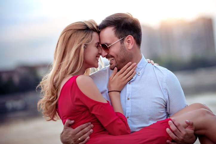 Happy young couple having fun outdoors