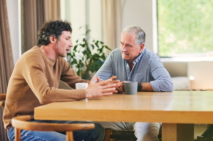 Father and son having a discussion.