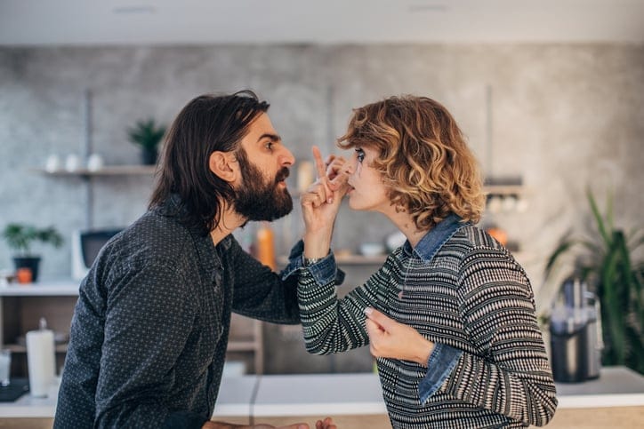 Man and woman, married couple arguing at home.