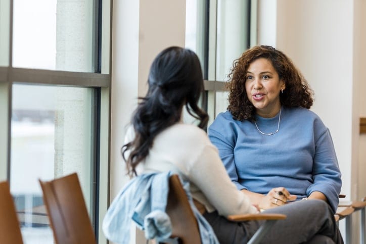 two friends having serious conversation