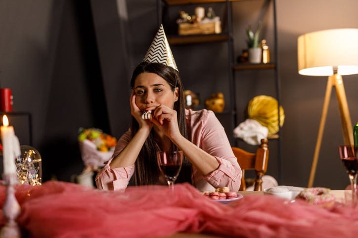 Young womanccelebrating her birthday alone.