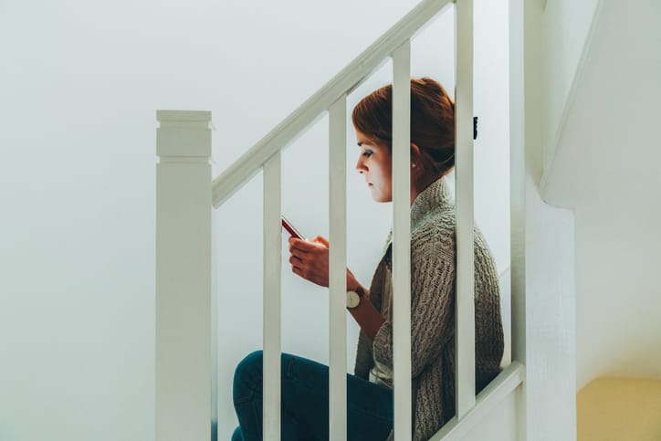 Woman feels worried because of cyberbullying attacks