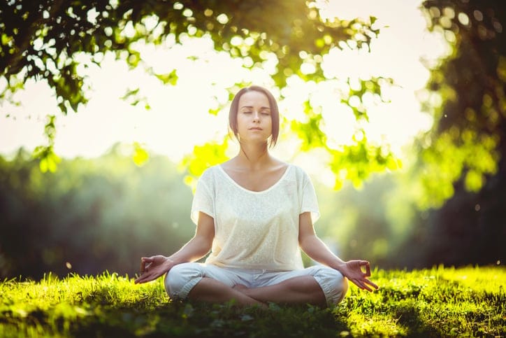 Woman doing yoga in the park.
