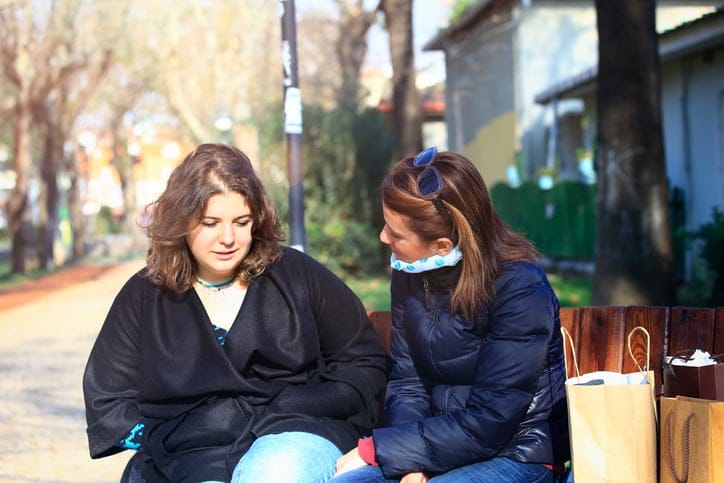 Mother talking to upset daughter