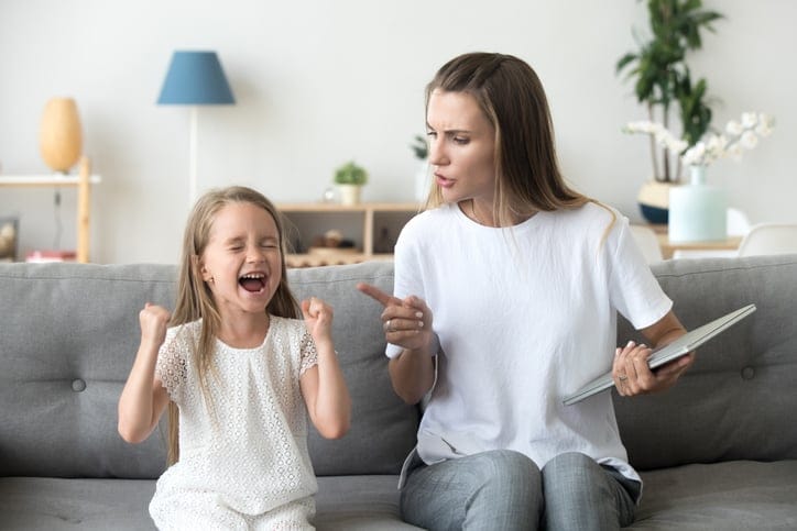 Strict mom scolding daughter.