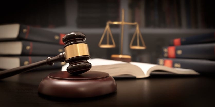 Judge gavel and scale in court.