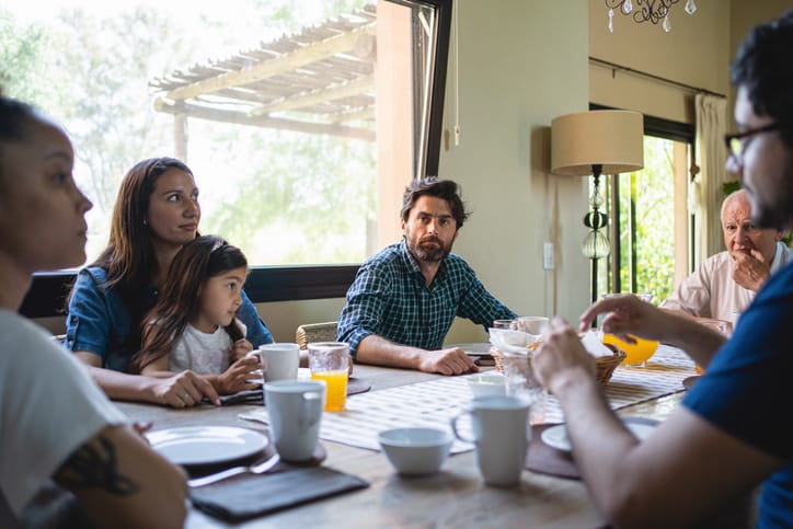 guy at dinner table with family