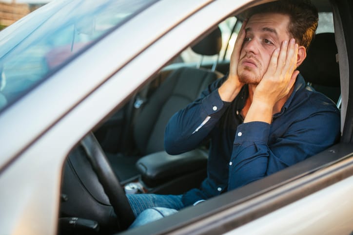 Frustrated man in traffic.