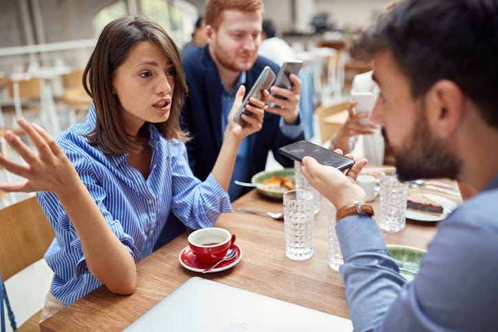 Businesswoman speaking with her colleagues.