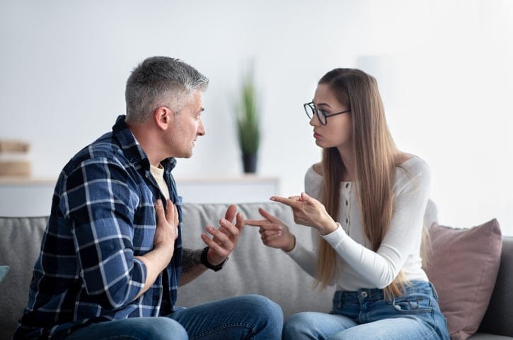 Mature married couple chatting at home