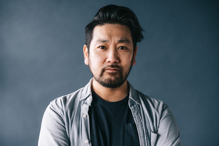 Japanese man looking serious.