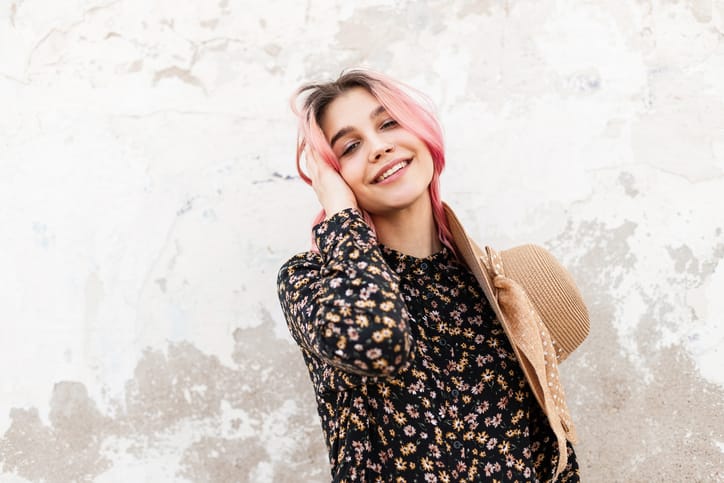 Happy young woman outside.