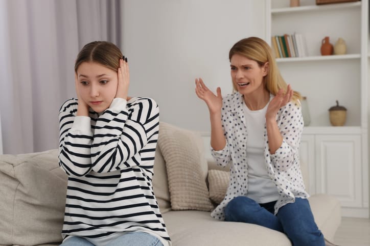 Mother scolding her teenage daughter.
