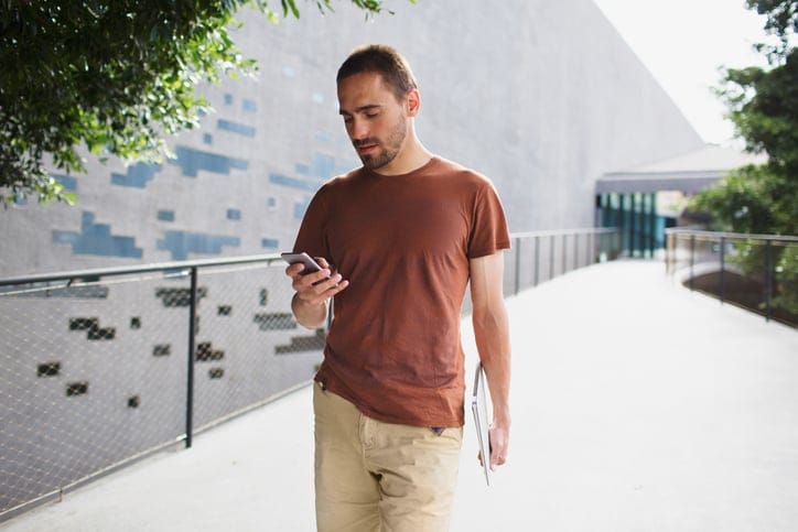 Man texting while walking.