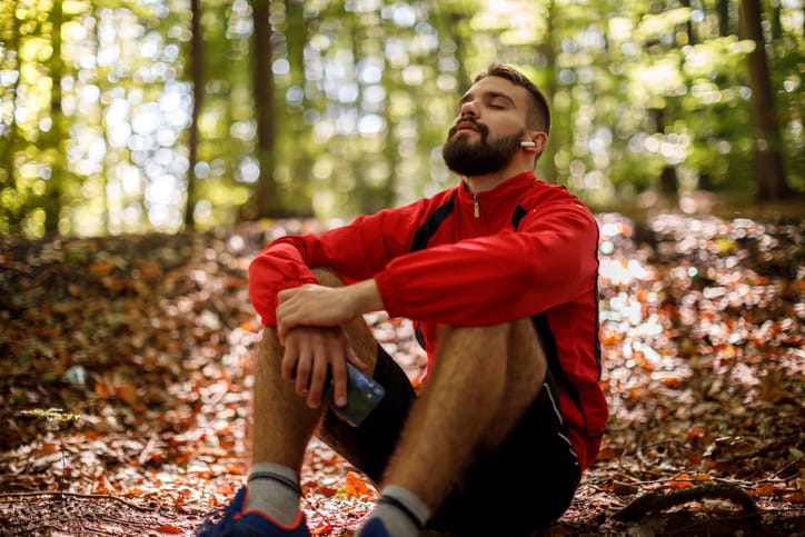 Portrait of relaxed young man camping.