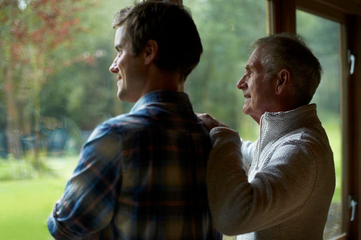 Thoughtful father and son at home.