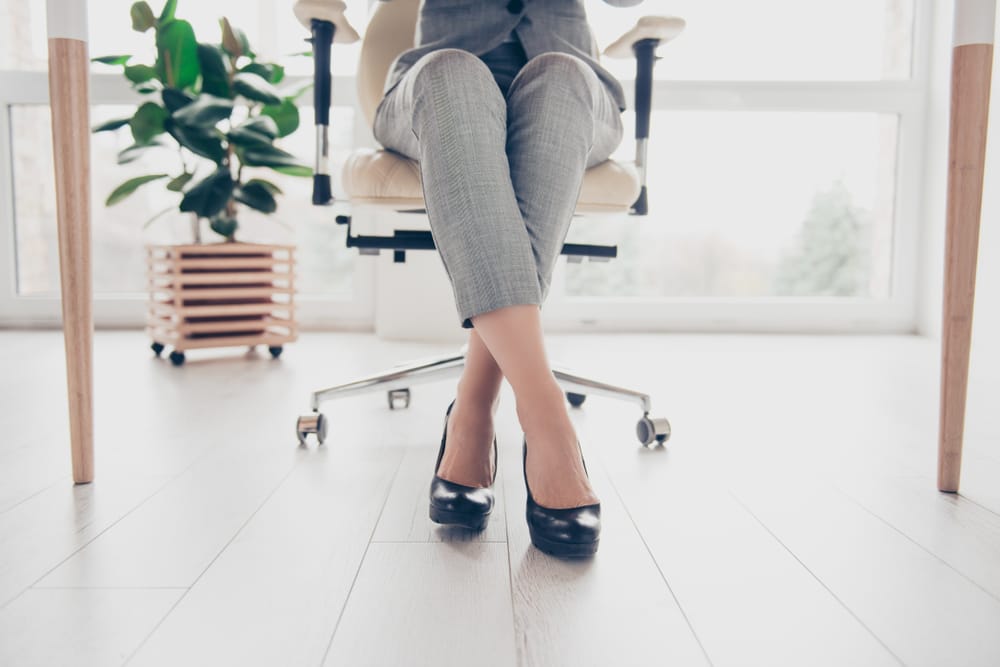 Woman in her office at her desk.
