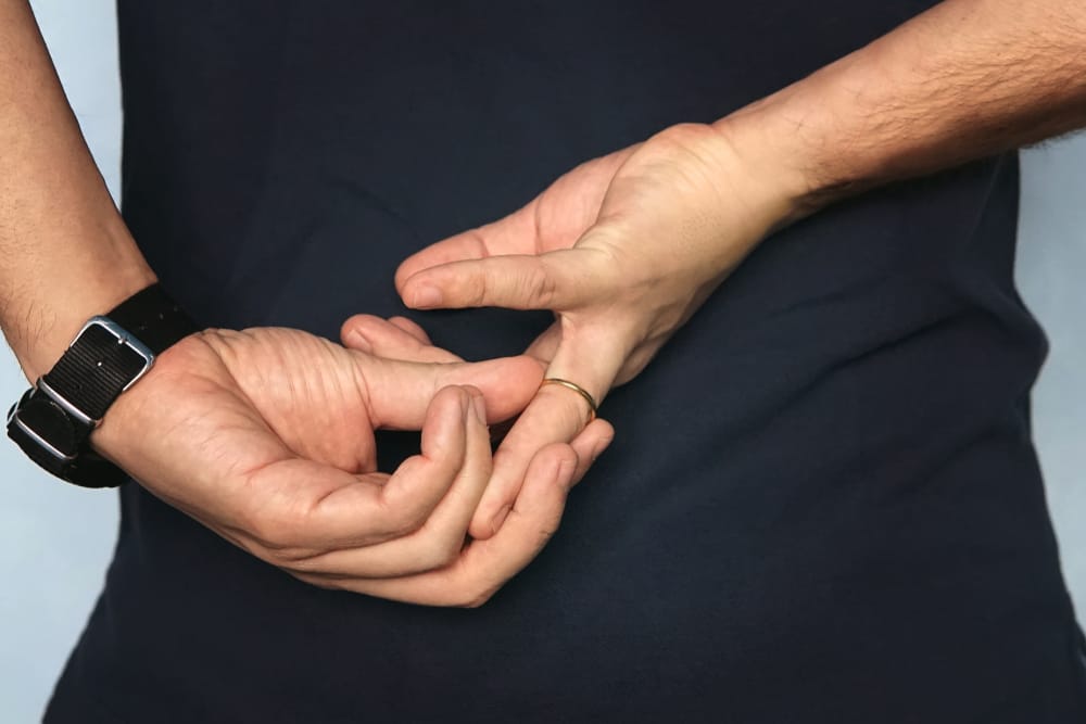 Man taking off his wedding ring.
