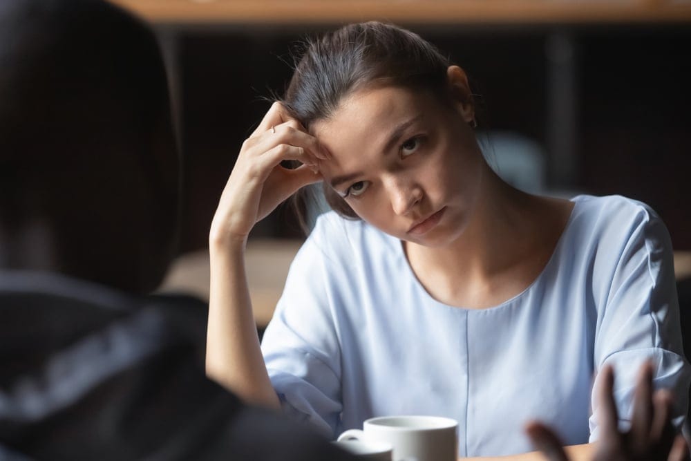 Woman bored with man's company.