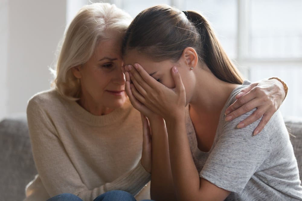 Mother and daughter having serious conversation.