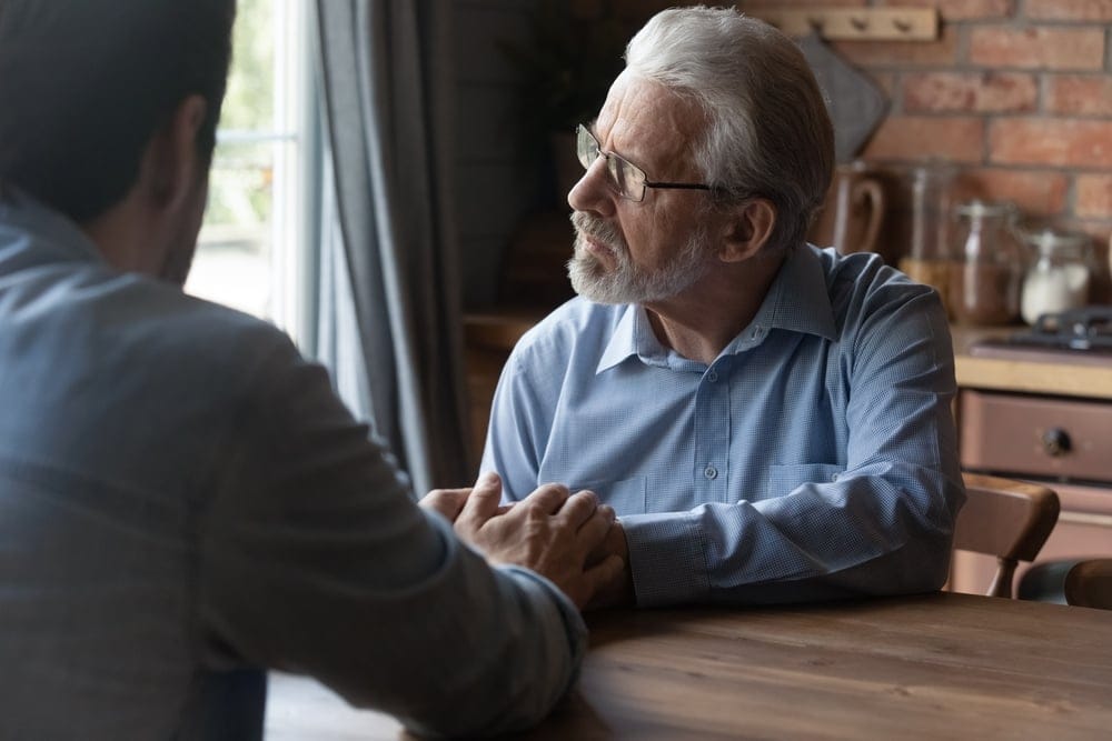 Man and his son having a chat.
