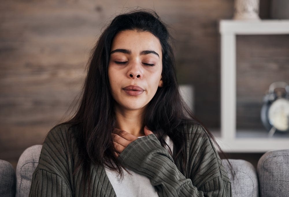 Woman doing breathing excercises.