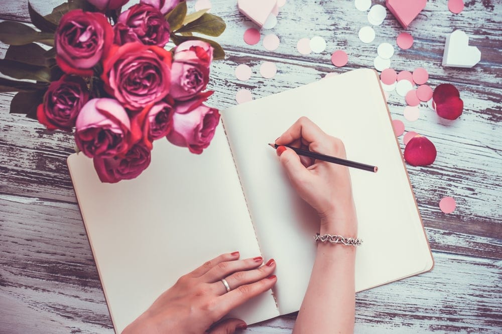 Woman writing in her journal.