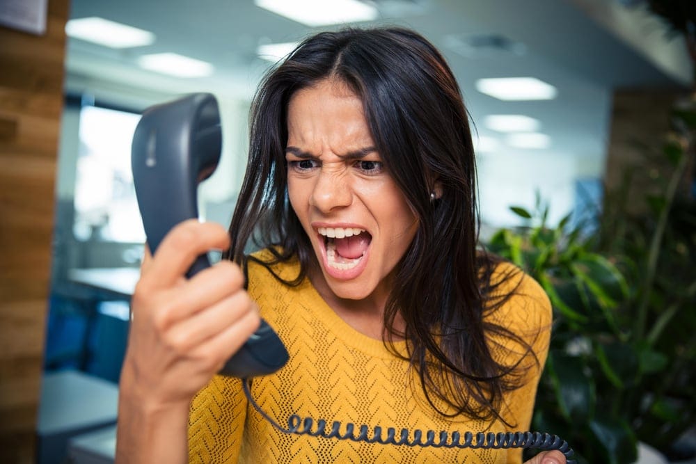Angry businesswoman on the phone.