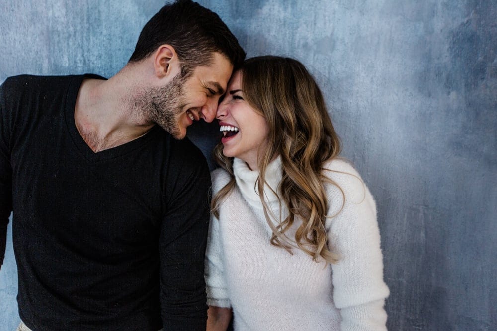 Couple smiling at one another.