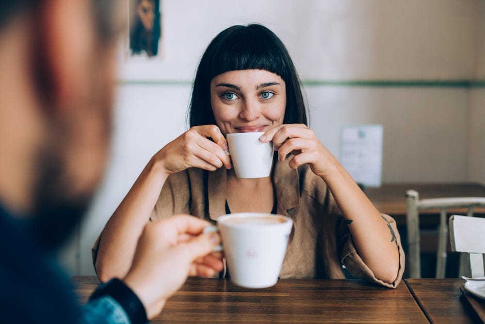 Woman drinking a cup of coffee.