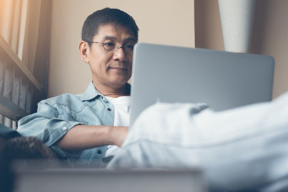 Man sitting at his computer.