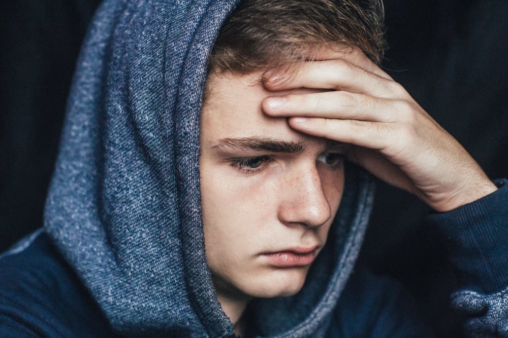 Young man looking stressed.