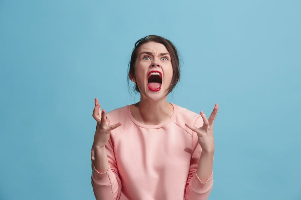 Woman screaming with frustration.