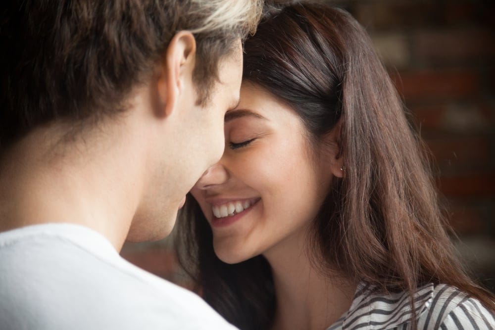 Young couple kissing.