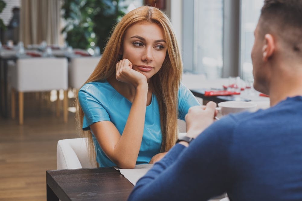 Woman bored with man's company.