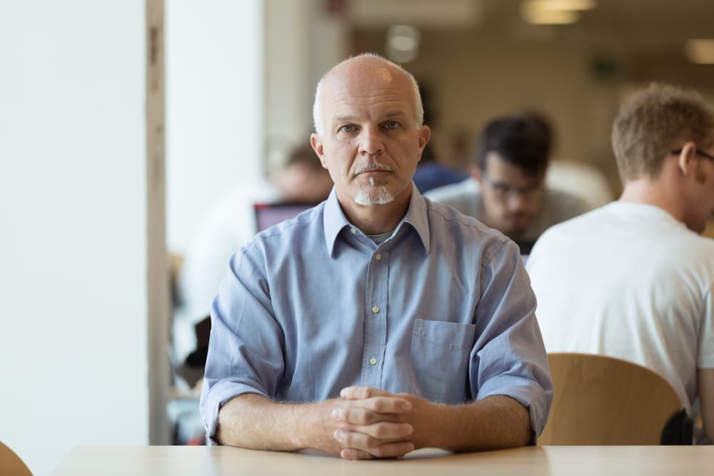 Man sitting alone looking professional.