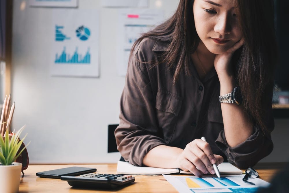 Woman using a calculator.