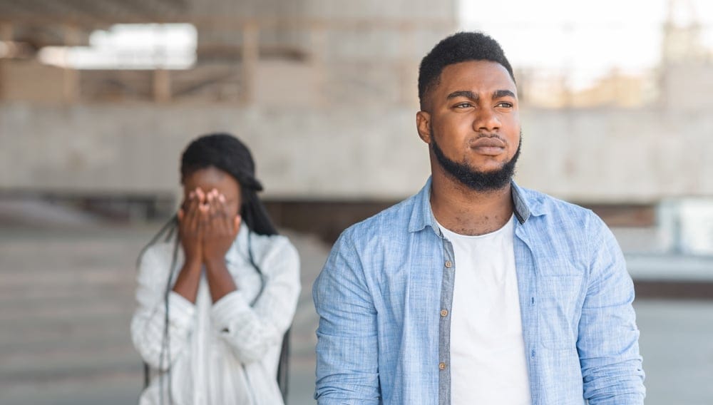 A woman is crying with her boyfriend.