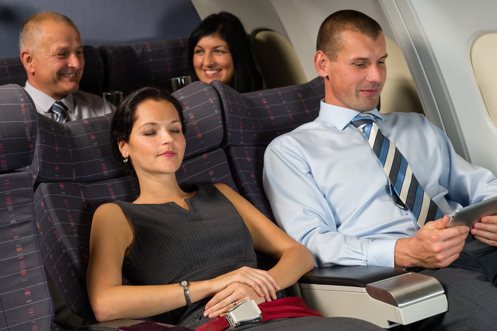 Airline passengers relaxing.
