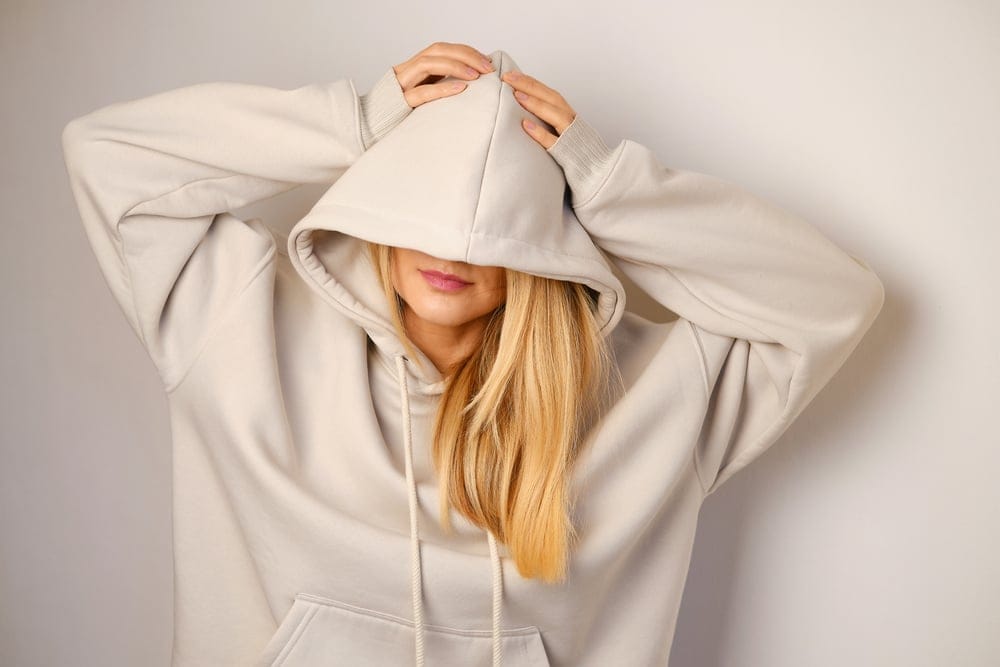 Young woman in a hoodie.